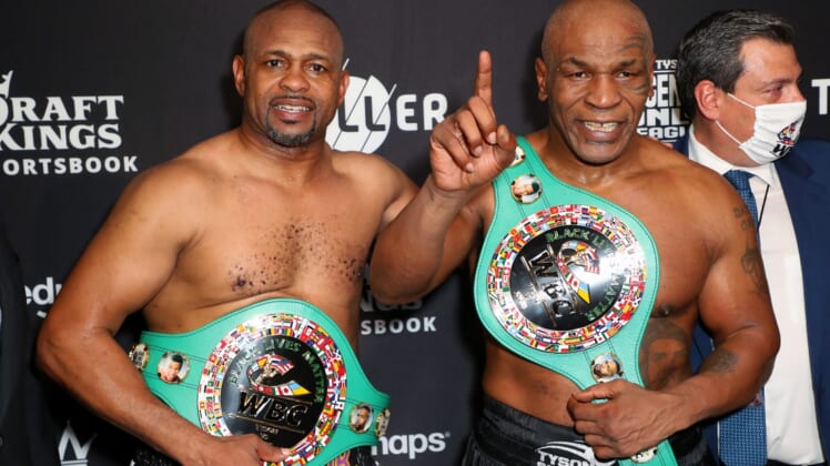 Nov 28, 2020; Los Angeles, CA, USA;  Mike Tyson and Roy Jones, Jr. pose with their belts after a split draw during a heavyweight exhibition boxing bout for the WBC Frontline Belt at the Staples Center.  Mandatory Credit: Joe Scarnici/Handout Photo via USA TODAY Sports