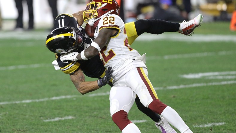 Dec 7, 2020; Pittsburgh, Pennsylvania, USA;  Pittsburgh Steelers wide receiver Chase Claypool (11) catches a pass against Washington Football Team free safety Deshazor Everett (22) during the second quarter at Heinz Field. Mandatory Credit: Charles LeClaire-USA TODAY Sports