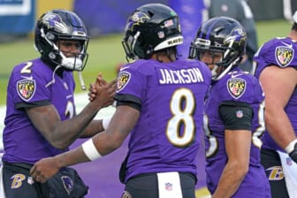 Dec 20, 2020; Baltimore, Maryland, USA; Baltimore Ravens quarterback Lamar Jackson (8) greets quarterback Tyler Huntley (2) prior to a game against the Jacksonville Jaguars at M&T Bank Stadium. Mandatory Credit: Mitch Stringer-USA TODAY Sports