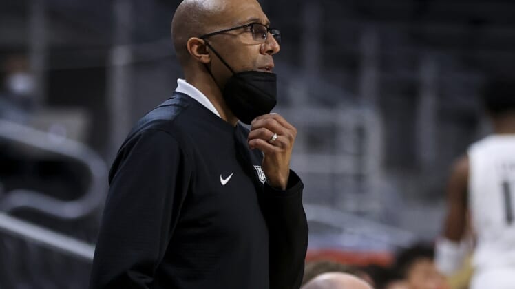 Feb 14, 2021; Cincinnati, Ohio, USA; UCF Knights head coach Johnny Dawkins works the sideline against the Cincinnati Bearcats in the first half at Fifth Third Arena. Mandatory Credit: Aaron Doster-USA TODAY Sports