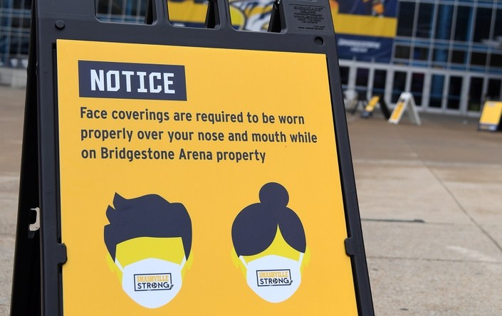 Feb 28, 2021; Nashville, Tennessee, USA; General view of mask signage outside Bridgestone Arena before the game between the Nashville Predators and the Columbus Blue Jackets. Mandatory Credit: Christopher Hanewinckel-USA TODAY Sports