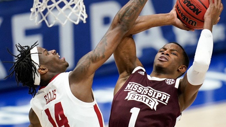 Alabama guard Keon Ellis (14) blocks a shot from Mississippi State guard Iverson Molinar (1) during the first half of the SEC Men's Basketball Tournament game at Bridgestone Arena in Nashville, Tenn., Friday, March 12, 2021.

Ms Ala Sec 031221 An 017