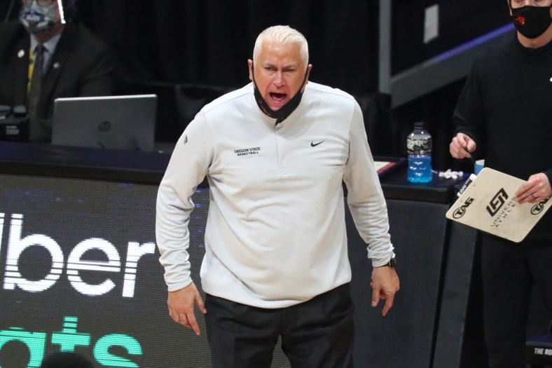 Mar 29, 2021; Indianapolis, Indiana, USA; Oregon State Beavers head coach Wayne Tinkle yells from the sidelines during the second half in the Elite Eight of the 2021 NCAA Tournament against the Houston Cougars at Lucas Oil Stadium. Mandatory Credit: Mark J. Rebilas-USA TODAY Sports