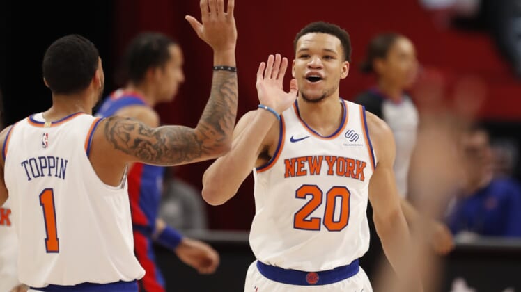 Apr 3, 2021; Detroit, Michigan, USA; New York Knicks forward Kevin Knox II (20) celebrates with forward Obi Toppin (1) after making a basket during the fourth quarter against the Detroit Pistons at Little Caesars Arena. Mandatory Credit: Raj Mehta-USA TODAY Sports