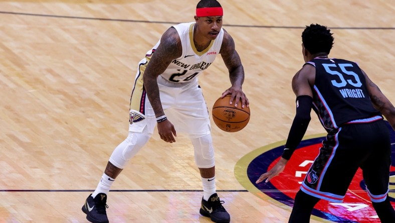 Apr 12, 2021; New Orleans, Louisiana, USA; New Orleans Pelicans guard Isaiah Thomas (24) dribbles against Sacramento Kings guard Delon Wright (55) during the second half at Smoothie King Center. Mandatory Credit: Stephen Lew-USA TODAY Sports