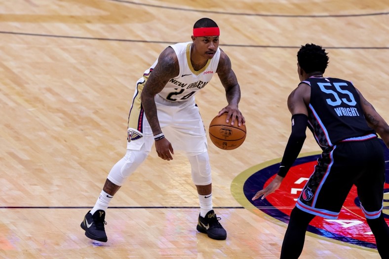 Apr 12, 2021; New Orleans, Louisiana, USA; New Orleans Pelicans guard Isaiah Thomas (24) dribbles against Sacramento Kings guard Delon Wright (55) during the second half at Smoothie King Center. Mandatory Credit: Stephen Lew-USA TODAY Sports