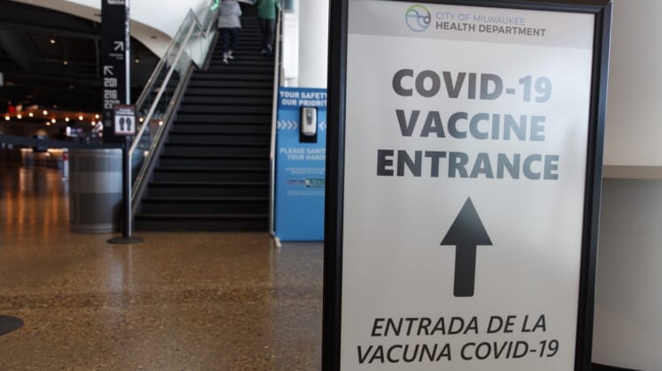 May 2, 2021; Milwaukee, Wisconsin, USA; A sign directing fans where to receive a COVID-19 vaccination prior to the game between the Milwaukee Bucks and the Brooklyn Netsat Fiserv Forum. Mandatory Credit: Jeff Hanisch-USA TODAY Sports