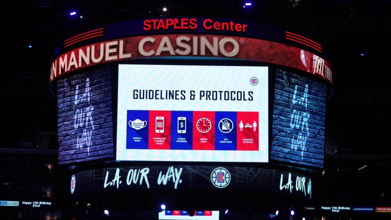 May 6, 2021; Los Angeles, California, USA; COVID-19 health and hygiene protocols are displayed on the Staples Center during the NBA game between the LA Clippers and the Los Angeles Lakers. Mandatory Credit: Kirby Lee-USA TODAY Sports