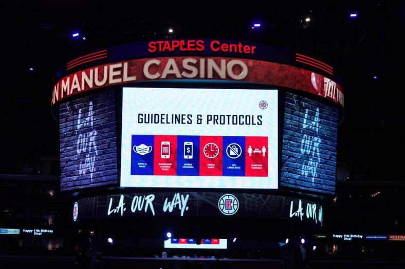 May 6, 2021; Los Angeles, California, USA; COVID-19 health and hygiene protocols are displayed on the Staples Center during the NBA game between the LA Clippers and the Los Angeles Lakers. Mandatory Credit: Kirby Lee-USA TODAY Sports