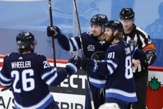 May 14, 2021; Winnipeg, Manitoba, CAN; Winnipeg Jets left wing Kyle Connor (81) celebrates his goal against the Toronto Maple Leafs with right wing Blake Wheeler (26) and center Mark Scheifele (55) during the second period at Bell MTS Place. Mandatory Credit: James Carey Lauder-USA TODAY Sports