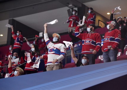 May 29, 2021; Montreal, Quebec, CAN; Fans cheer during the warmup period before game six between the Toronto Maple Leafs and the Montreal Canadiens in the first round of the 2021 Stanley Cup Playoffs at the Bell Centre. This is the first game in Canada with a limited attendance allowed since the Covid 19 pandemic. Mandatory Credit: Eric Bolte-USA TODAY Sports