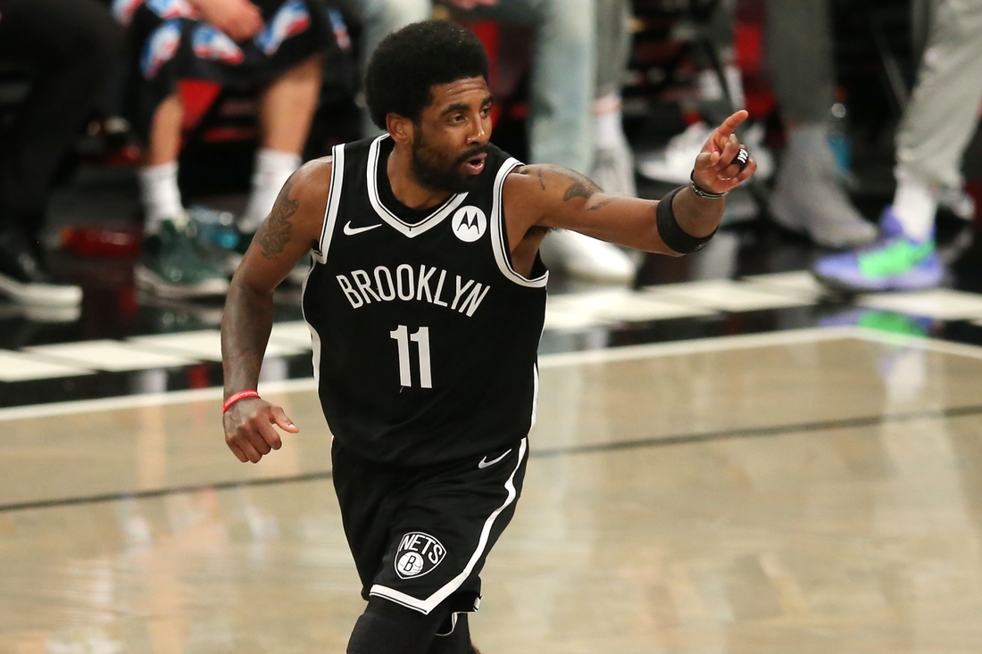 Jun 5, 2021; Brooklyn, New York, USA; Brooklyn Nets point guard Kyrie Irving (11) reacts after making a basket against the Milwaukee Bucks during the second quarter of game one in the Eastern Conference semifinals of the 2021 NBA Playoffs at Barclays Center. Mandatory Credit: Brad Penner-USA TODAY Sports