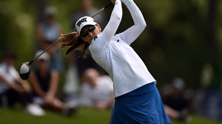 Jun 24, 2021; John's Creek, Georgia, USA; Austin Ernst plays her shot from the 18th tee during the first round of the KPMG Women's PGA Championship golf tournament at the Atlanta Athletic Club. Mandatory Credit: Adam Hagy-USA TODAY Sports