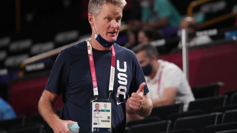 Aug 4, 2021; Saitama, Japan; USA men's basketball assistant coach Steve Kerr watches as the USA women's basketball team plays Australia during the Tokyo 2020 Olympic Summer Games at Saitama Super Arena. Mandatory Credit: Kyle Terada-USA TODAY Sports