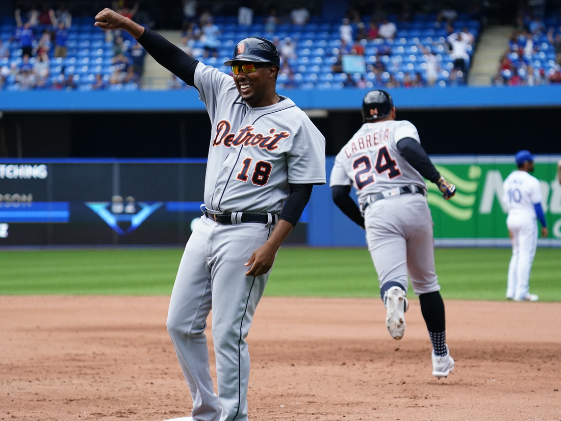 Aug 22, 2021; Toronto, Ontario, CAN; Detroit Tigers first base coach Kimera Bartee (18) celebrartes designated hitter Miguel Cabrera (24) solo homerun against the Toronto Blue Jays in the sixth inning at Rogers Centre. The homerun was the 500th of his career. Mandatory Credit: John E. Sokolowski-USA TODAY Sports