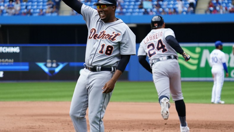 Aug 22, 2021; Toronto, Ontario, CAN; Detroit Tigers first base coach Kimera Bartee (18) celebrartes designated hitter Miguel Cabrera (24) solo homerun against the Toronto Blue Jays in the sixth inning at Rogers Centre. The homerun was the 500th of his career. Mandatory Credit: John E. Sokolowski-USA TODAY Sports