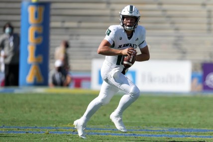Aug 28, 2021; Pasadena, California, USA; Hawaii Rainbow Warriors  quarterback Brayden Schager (13) drops back to pass in the fourth quarter against the UCLA Bruinsat Rose Bowl. Mandatory Credit: Kirby Lee-USA TODAY Sports