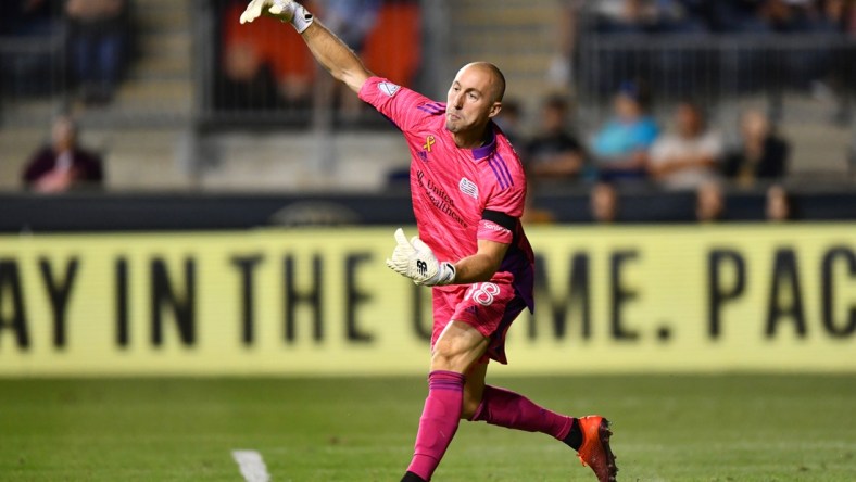 Sep 3, 2021; Philadelphia, Pennsylvania, USA; New England Revolution keeper Brad Knighton (18) passes the ball in the second half against the Philadelphia Union at Subaru Park. Mandatory Credit: Kyle Ross-USA TODAY Sports