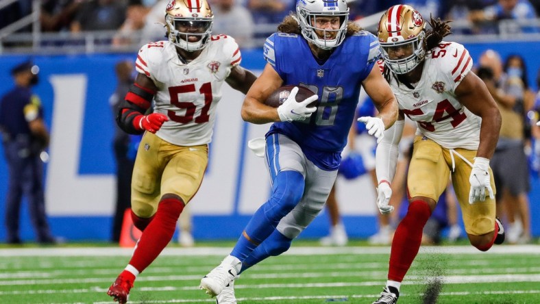 Detroit Lions tight end T.J. Hockenson (88) runs against San Francisco 49ers linebacker Fred Warner (54) during the second half at Ford Field in Detroit on Sunday, Sept. 12, 2021.