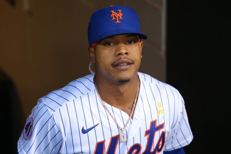 Sep 14, 2021; New York City, New York, USA; New York Mets starting pitcher Marcus Stroman (0) exits the dugout to begin warming up before his start against the St. Louis Cardinals at Citi Field. Mandatory Credit: Brad Penner-USA TODAY Sports