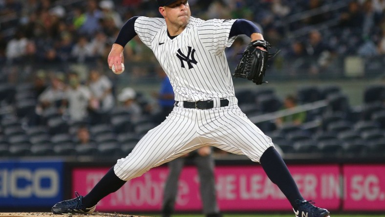Sep 17, 2021; Bronx, New York, USA; New York Yankees starting pitcher Corey Kluber (28) pitches against the Cleveland Indians during the first inning at Yankee Stadium. Mandatory Credit: Andy Marlin-USA TODAY Sports