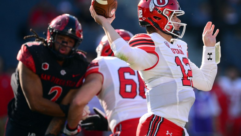 Sep 18, 2021; Carson, California, USA; Utah Utes quarterback Charlie Brewer (12) throws against the San Diego State Aztecs during the first half at Dignity Health Sports Park. Mandatory Credit: Gary A. Vasquez-USA TODAY Sports