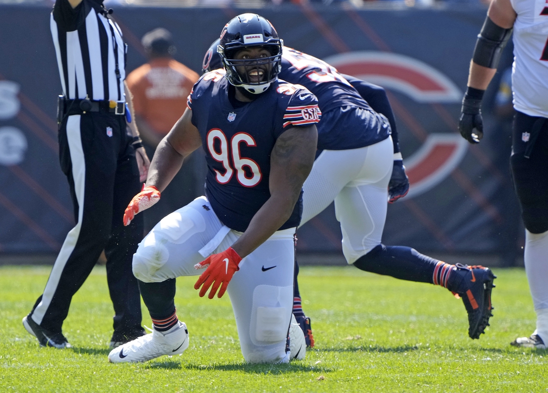 Sep 19, 2021; Chicago, Illinois, USA; Chicago Bears defensive end Akiem Hicks (96) reacts after sacking Cincinnati Bengals quarterback Joe Burrow (not pictured) during the second half at Soldier Field. Mandatory Credit: Mike Dinovo-USA TODAY Sports