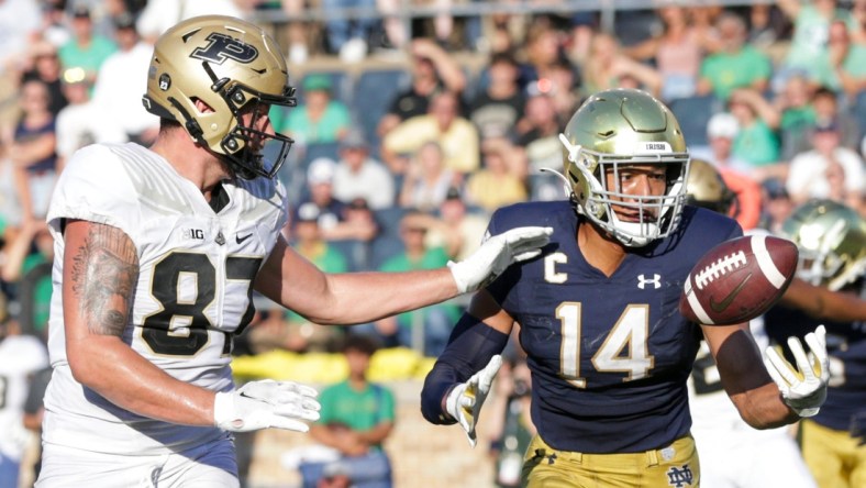 Notre Dame safety Kyle Hamilton (14) intercepts a pass intended for Purdue tight end Payne Durham (87) in the end zone during the fourth quarter of an NCAA football game, Saturday, Sept. 18, 2021 at Notre Dame Stadium in South Bend.

Cfb Notre Dame Vs Purdue