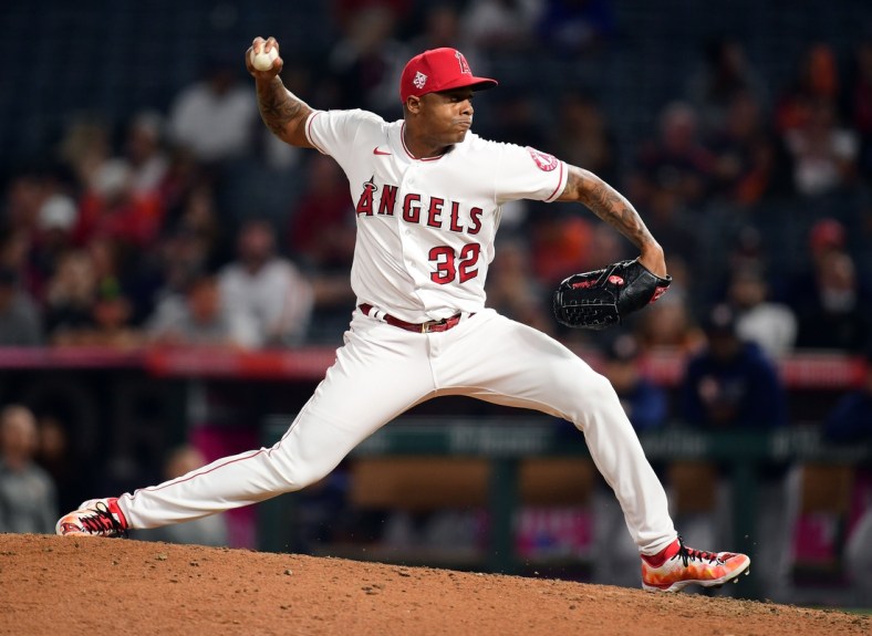 Sep 23, 2021; Anaheim, California, USA; Los Angeles Angels relief pitcher Raisel Iglesias (32) throws against the Houston Astros during the ninth inning at Angel Stadium. Mandatory Credit: Gary A. Vasquez-USA TODAY Sports