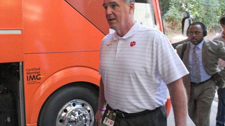 Clemson University Athletic Director Dan Radakovich gets off the bus before the game with NC State University at Carter-Finley Stadium in Raleigh, N.C., September 25, 2021.

Ncaa Football Clemson At Nc State