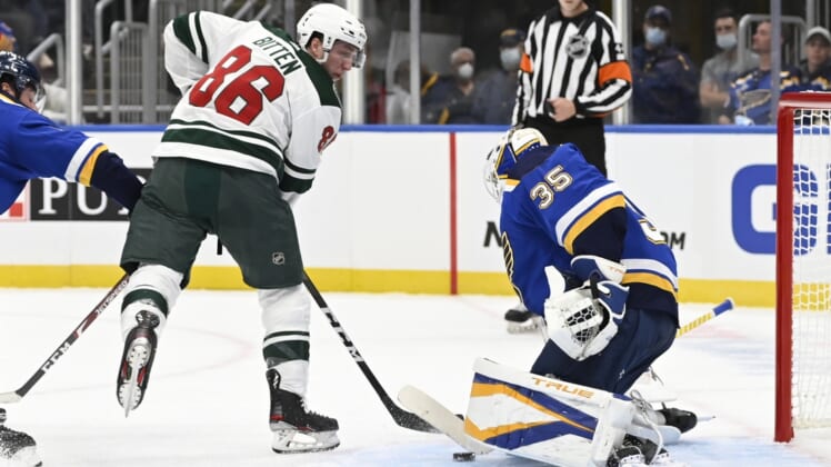 Sep 25, 2021; St. Louis, Missouri, USA; St. Louis Blues goaltender Ville Husso (35) makes a save against Minnesota Wild forward William Bitten (86) in the first period at Enterprise Center. Mandatory Credit: Jeff Le-USA TODAY Sports