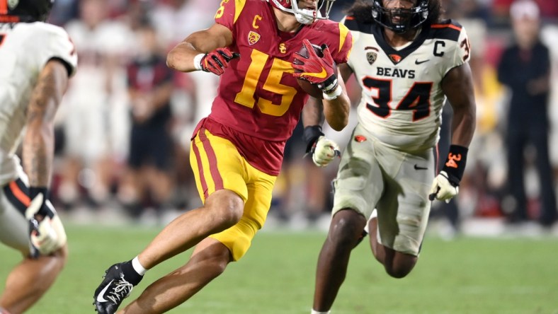 Sep 25, 2021; Los Angeles, California, USA; USC Trojans wide receiver Drake London (15) runs the ball after a complete pass in the second half of the game at United Airlines Field at Los Angeles Memorial Coliseum. Mandatory Credit: Jayne Kamin-Oncea-USA TODAY Sports