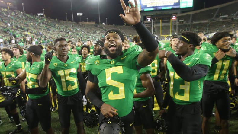 Oregon's Kayvon Thibodeaux celebrates with teammates after the win over Arizona in their first Pac-12 game of the season.Eug 0922521 Uo Az 16