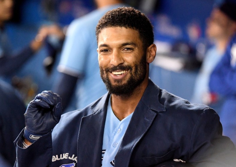 Sep 29, 2021; Toronto, Ontario, CAN; Toronto Blue Jays second baseman Marcus Semien (10) wears the team home run jacket in the dugout after hitting a two-run home run against New York Yankees in the first inning at Rogers Centre. Mandatory Credit: Dan Hamilton-USA TODAY Sports