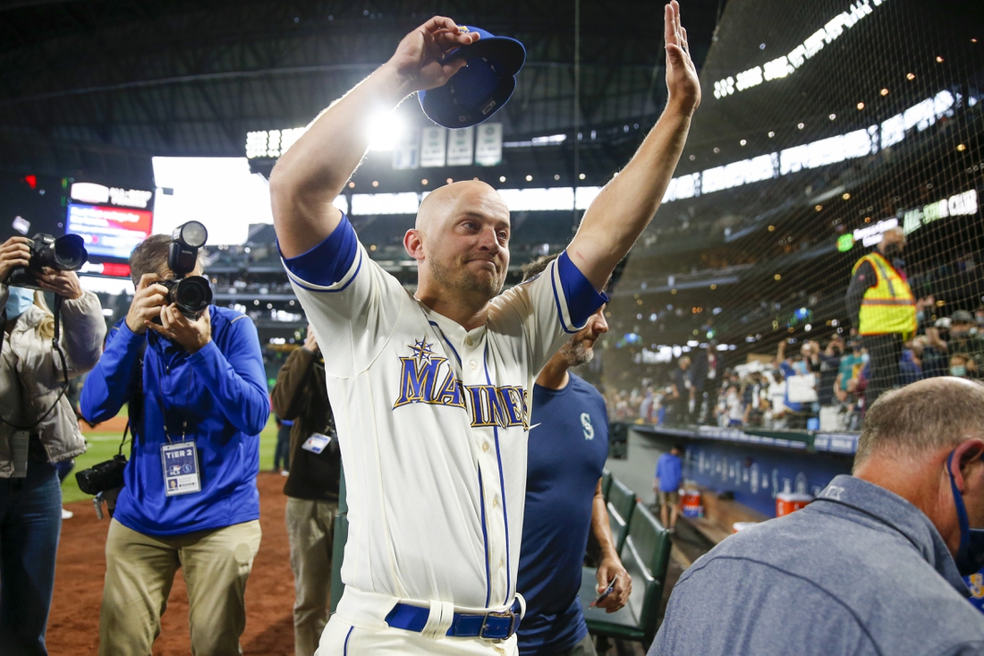 Oct 3, 2021; Seattle, Washington, USA; Seattle Mariners third baseman Kyle Seager (15) waves to fans following a 7-3 loss against the Los Angeles Angels at T-Mobile Park. Mandatory Credit: Joe Nicholson-USA TODAY Sports