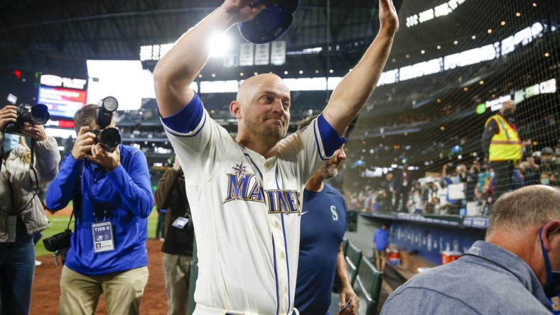 Oct 3, 2021; Seattle, Washington, USA; Seattle Mariners third baseman Kyle Seager (15) waves to fans following a 7-3 loss against the Los Angeles Angels at T-Mobile Park. Mandatory Credit: Joe Nicholson-USA TODAY Sports