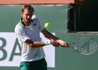 Oct 13, 2021; Indian Wells, CA, USA; Daniil Medvedev (RUS) hits a shot against Grigor Dimitrov (BUL) in his fourth round match during the BNP Paribas Open at the Indian Wells Tennis Garden. Mandatory Credit: Jayne Kamin-Oncea-USA TODAY Sports