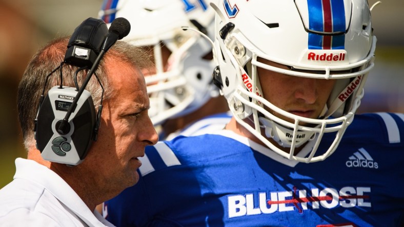 Presbyterian College head coach Kevin Kelley speaks with quarterback Ren Hefley (12) during their game against Morehead State at Bailey Memorial Stadium Saturday, Oct. 9, 2021.

Jm Prescollege 101221 007