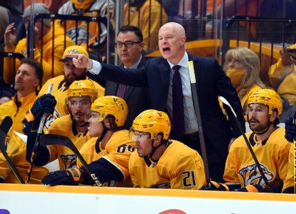 Oct 16, 2021; Nashville, Tennessee, USA; Nashville Predators head coach John Hynes yells from the bench during the first period against the Carolina Hurricanes at Bridgestone Arena. Mandatory Credit: Christopher Hanewinckel-USA TODAY Sports