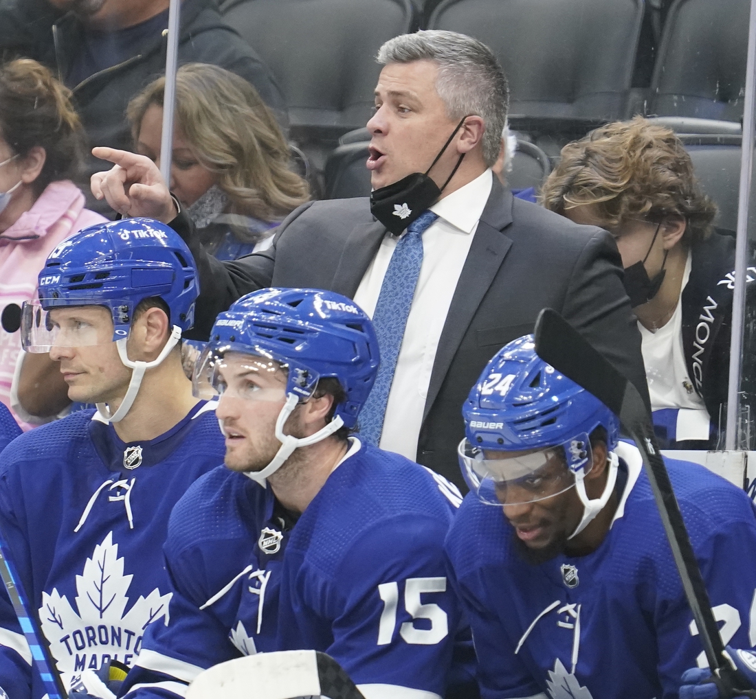 Oct 16, 2021; Toronto, Ontario, CAN; Toronto Maple Leafs head coach Sheldon Keefe gives instructions during the third period against the Ottawa Senators at Scotiabank Arena. Mandatory Credit: John E. Sokolowski-USA TODAY Sports