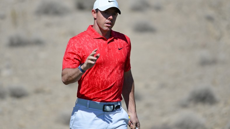 Oct 17, 2021; Las Vegas, Nevada, USA; Rory McIlroy waves to the crowd after making a putt on the second green during the final round of the CJ Cup golf tournament. Mandatory Credit: Joe Camporeale-USA TODAY Sports