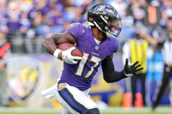 Oct 17, 2021; Baltimore, Maryland, USA; Baltimore Ravens running back Le'Veon Bell (17) carries the ball against the Los Angeles Chargers during the second half at M&T Bank Stadium. Mandatory Credit: Vincent Carchietta-USA TODAY Sports