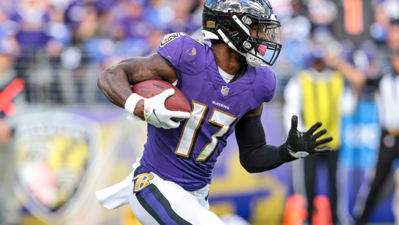 Oct 17, 2021; Baltimore, Maryland, USA; Baltimore Ravens running back Le'Veon Bell (17) carries the ball against the Los Angeles Chargers during the second half at M&T Bank Stadium. Mandatory Credit: Vincent Carchietta-USA TODAY Sports