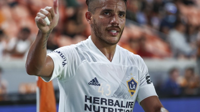 Oct 20, 2021; Houston, Texas, USA; LA Galaxy midfielder Jonathan dos Santos (8) walks off the field during the second half against the Houston Dynamo FC at PNC Stadium. Mandatory Credit: Troy Taormina-USA TODAY Sports