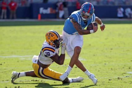 Oct 23, 2021; Oxford, Mississippi, USA; Mississippi Rebels quarterback Matt Corral (2) is sacked for a loss by LSU Tigers linebacker Damone Clark (18) during the first half at Vaught-Hemingway Stadium. Mandatory Credit: Petre Thomas-USA TODAY Sports