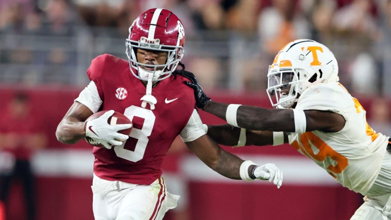 Oct 23, 2021; Tuscaloosa, Alabama, USA; Alabama Crimson Tide wide receiver John Metchie III (8) is pushed out of bounds by Tennessee Volunteers defensive back Brandon Turnage (29) during the first half at Bryant-Denny Stadium. Mandatory Credit: Butch Dill-USA TODAY Sports