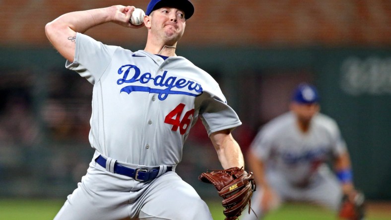 Oct 23, 2021; Cumberland, Georgia, USA; Los Angeles Dodgers relief pitcher Corey Knebel (46) pitches during the seventh inning against the Atlanta Braves in game six of the 2021 NLCS at Truist Park. Mandatory Credit: Brett Davis-USA TODAY Sports