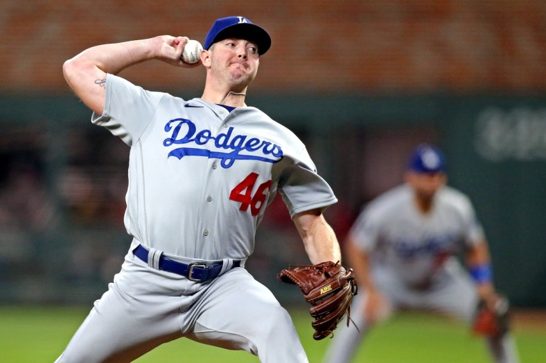 Oct 23, 2021; Cumberland, Georgia, USA; Los Angeles Dodgers relief pitcher Corey Knebel (46) pitches during the seventh inning against the Atlanta Braves in game six of the 2021 NLCS at Truist Park. Mandatory Credit: Brett Davis-USA TODAY Sports