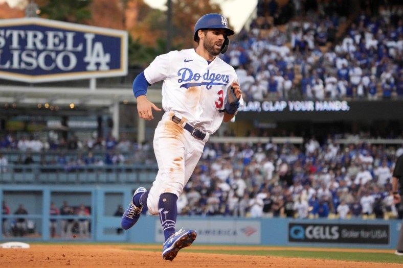 Oct 19, 2021; Los Angeles, California, USA; Los Angeles Dodgers left fielder Chris Taylor (3) rounds third base against the Atlanta Braves in the eighth inning during game three of the 2021 NLCS at Dodger Stadium. The Dodgers defeated the Braves 6-5. Mandatory Credit: Kirby Lee-USA TODAY Sports