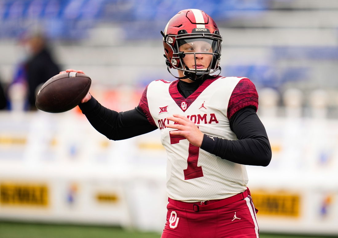 Oct 23, 2021; Lawrence, Kansas, USA; Oklahoma Sooners quarterback Spencer Rattler (7) warms up before the game against the Kansas Jayhawks at David Booth Kansas Memorial Stadium. Mandatory Credit: Jay Biggerstaff-USA TODAY Sports